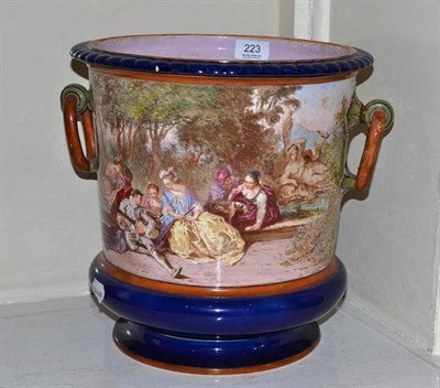 Lot 223 - A Minton Majolica Jardiniere, painted with figures in a landscape, 29.5cm diameter
