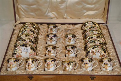 Lot 224 - A Royal Crown Derby Twelve Piece Setting; and An Imari Pattern Coffee Service, in a fitted case