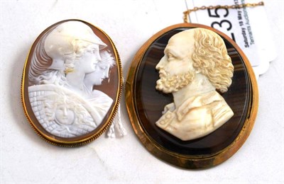 Lot 235 - A Cameo Brooch, the oval shell carved with classical figures, in a yellow millegrain frame,...