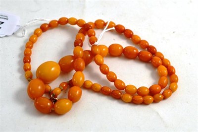 Lot 267 - An Amber Necklace, seventy-one oval polished beads of golden-yellow to orange colour, length 65.5cm