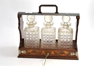 Lot 307 - A Late Victorian Walnut and Marquetry Three Bottle Tantalus, with silver plated fittings and...