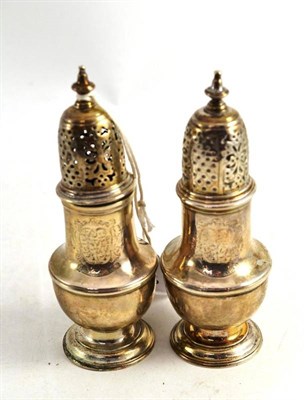 Lot 319 - A Pair of George II Silver Castors, London 1746, engraved with family crest, height 13cm