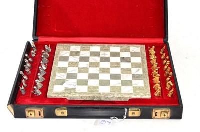 Lot 341 - A 9ct White and Yellow Gold Chess Set, 276g approximate weight, and board, cased