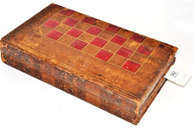 Lot 342 - A Stained and Natural Ivory Chess Set, in a book-form chess and backgammon case, king 9cm high