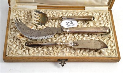 Lot 353 - A Russian Silver Three Piece Fish Serving Set, comprising fish fork and knife and steel bladed...