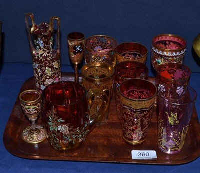 Lot 360 - Thirteen assorted pieces of cranberry and gilt decorated glass, mostly tumblers of assorted sizes