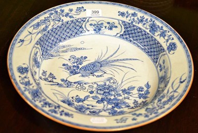 Lot 399 - A Chinese Blue and White Charger, decorated with flowers and a Greek key border, diameter 39.5cm