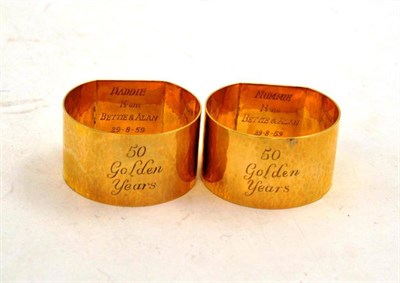 Lot 459 - A Pair of 9ct Gold Napkin Rings, each inscribed