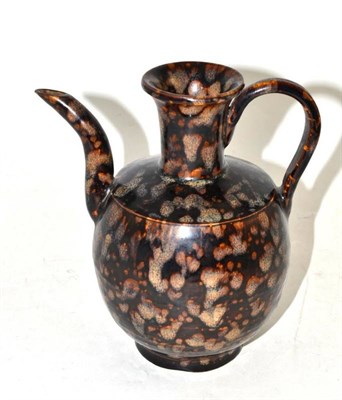 Lot 482 - A Chinese Splashed and Black Glazed Ewer, in Tang Dynasty style, with short trumpet neck,...