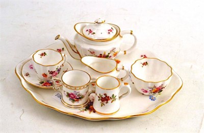 Lot 491 - A Royal Crown Derby Floral Miniature Tea Set, on tray, Two Miniature Mugs (7)