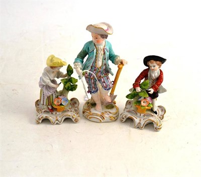 Lot 501 - A Meissen Figure of a Gardener, height 14cm; and A Pair of Dresden Figures of Gardeners, height...