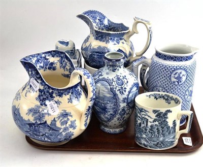 Lot 513 - Three Blue Printed Jugs; Two Mugs; A Vase; A Jug; A Caddy; and A Cover (8)