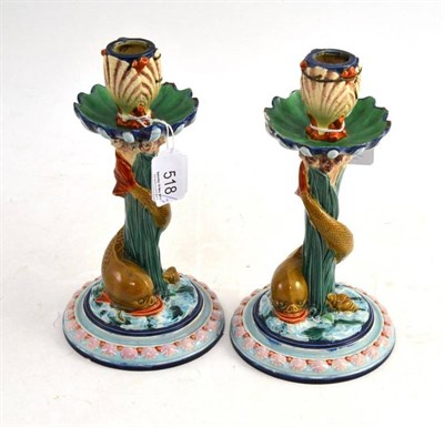 Lot 518 - A Pair of Royal Worcester Majolica Candlesticks, with stylised dolphins and shell motifs,...