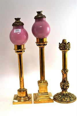 Lot 530 - A Pair of Brass Candle Lamps, maker Palmer & Co, London, with pink glass shades, height 50cm; and A