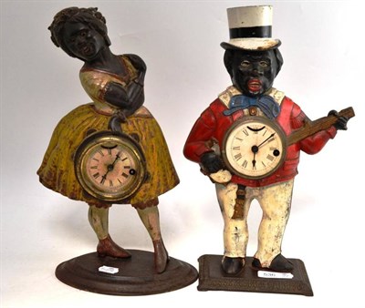 Lot 536 - Two Cast Iron Figural Rocking Eye Automata Timepieces, the first: a gentleman wearing a top hat and