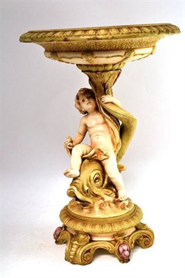 Lot 549 - A Royal Dux Centrepiece, with dolphin and cherub figural support, printed stamp to base, height...