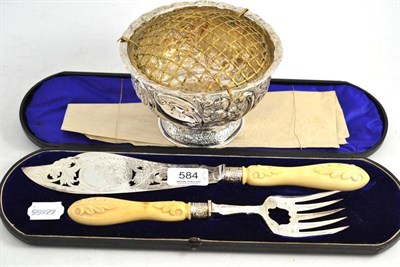 Lot 584 - A Silver Plated Fish Knife and Fork, with carved handles, the blade engraved with a fisherman,...