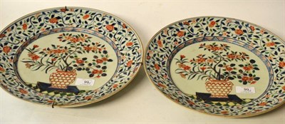 Lot 603 - A Pair of Imari Porcelain Dishes, 18th century, painted with jardinières of foliage in...