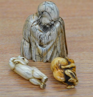 Lot 612 - A Japanese Ivory Netsuke, 19th century, as a fox and large gourd shaped bug, 4cm; Another, in...