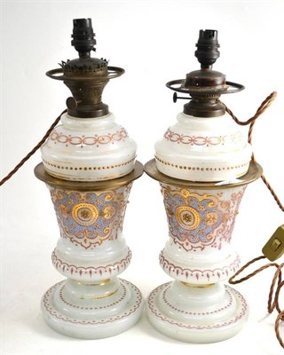 Lot 625 - A Pair of Late 19th Century Opaque Glass Lamps, with overlay decoration, height 41cm  Ex....