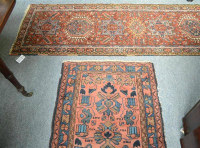 Lot 670 - Narrow Karajah Runner  Persian Azerbaijan The terracotta field with a row of medallions enclosed by