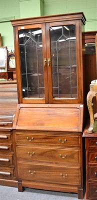 Lot 680 - An Early 20th Century Mahogany Bureau Bookcase, with leaded glass doors, 77cm wide