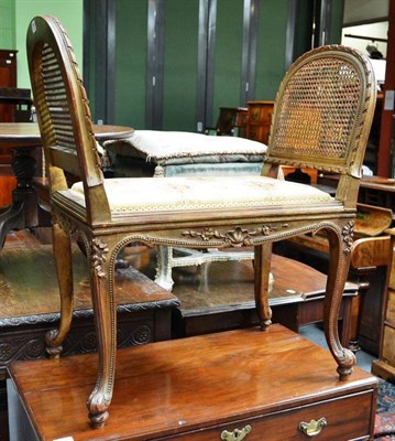 Lot 685 - A Gilt Beechwood Window Seat, with rectangular upholstered seat and double caned ends, 77cm wide