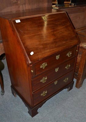 Lot 689 - A George III Style Mahogany Bureau, of small proportions, the fall enclosing a fitted interior...