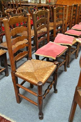 Lot 736 - A Harlequin Set of Six Ash and Elm Rush Seated Ladderback Chairs, 50cm wide