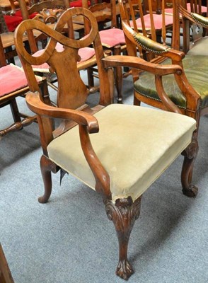 Lot 738 - A George I Style Walnut Armchair, with shaped back support, outswept arms and green velvet...