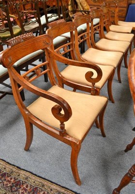 Lot 741 - A Set of Nine Regency Oak Dining Chairs, 2nd quarter 19th century, the gadrooned curved top...