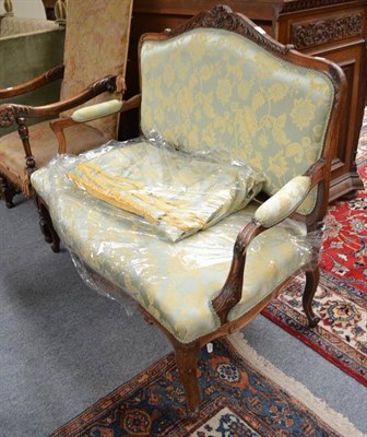 Lot 755 - A Late 19th Century French Settee, upholstered in green floral damask (with seven meters spare...