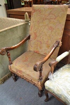 Lot 757 - A Carved Oak Armchair, in 17th century style, upholstered in old needlework fabric, 61cm wide