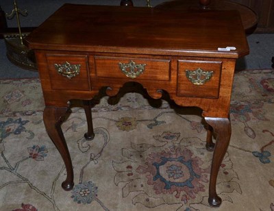 Lot 760 - A Mahogany Three Drawer Lowboy, with canted corners, 77cm wide