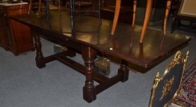 Lot 771 - An Oak Draw Leaf Dining Table, with cleated ends, 260cm (extended)