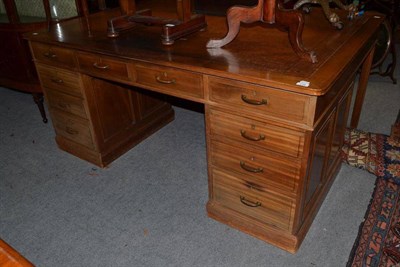 Lot 779 - An Early 20th Century Mahogany Desk, with brown leather writing surface, ten drawers and raised...