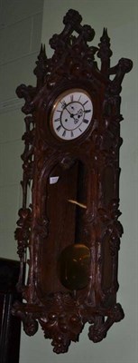 Lot 815 - A Black Forest Striking Wall Clock, circa 1890, carved case with floral decoration, 6-inch...