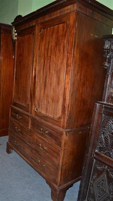 Lot 817 - A George III Mahogany Linen Press, with dentil cornice, converted to a wardrobe, 128cm wide