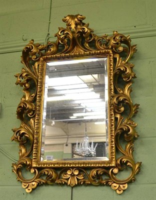 Lot 826 - A Gilt Gesso Florentine Wall Mirror, with rectangular bevelled plate and scrolled acanthus carving