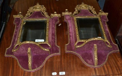 Lot 841 - A Pair of Late Victorian Giltwood and Mirrored Wall Brackets, covered in red fabric, each...