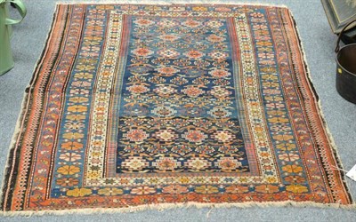 Lot 854 - Chi Chi Rug North East Caucasus The indigo field with rows of hooked guls enclosed by flower...