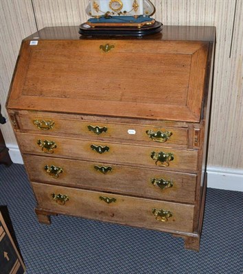 Lot 860 - A George III Oak Bureau, with fitted interior, 37cm wide