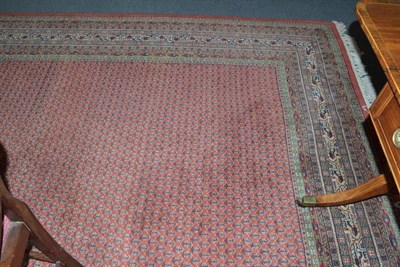 Lot 874 - Indian Carpet  Modern of Serabend Design The rust field with an allover design of boteh enclosed by