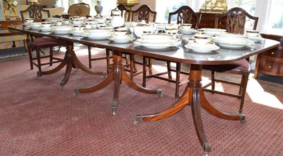 Lot 885 - A Triple Pillar Mahogany Dining Table, in George III style, 289cm long