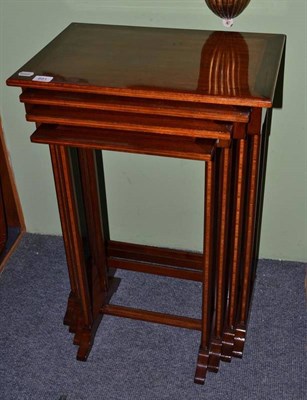 Lot 891 - A Set of Four Edwardian Mahogany and Tulipwood Banded Nesting Tables, the largest 52cm wide