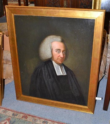 Lot 1167 - English School (19th century) Portrait of a clergyman, standing, half length, wearing black...