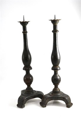 Lot 1223 - A Pair of Painted Oak Candlesticks, on triform bases, height 60cm