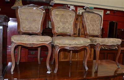 Lot 1236 - A Set of Six 19th Century Walnut Salon Chairs, upholstered in floral damask, 48cm wide