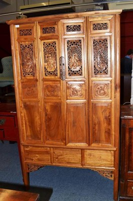 Lot 1247 - A Chinese Camphor Wood Decorative Cabinet, 20th century, with foliate carved panels and...