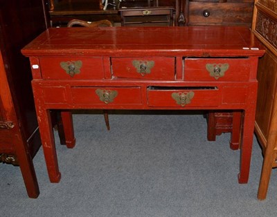 Lot 1248 - A Chinese Red Lacquer Side Table, 20th century, fitted with five drawers and raised on hoof feet